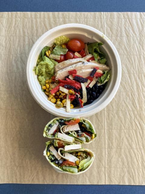 Bowl of salad and a wrap from 创造性的绿色